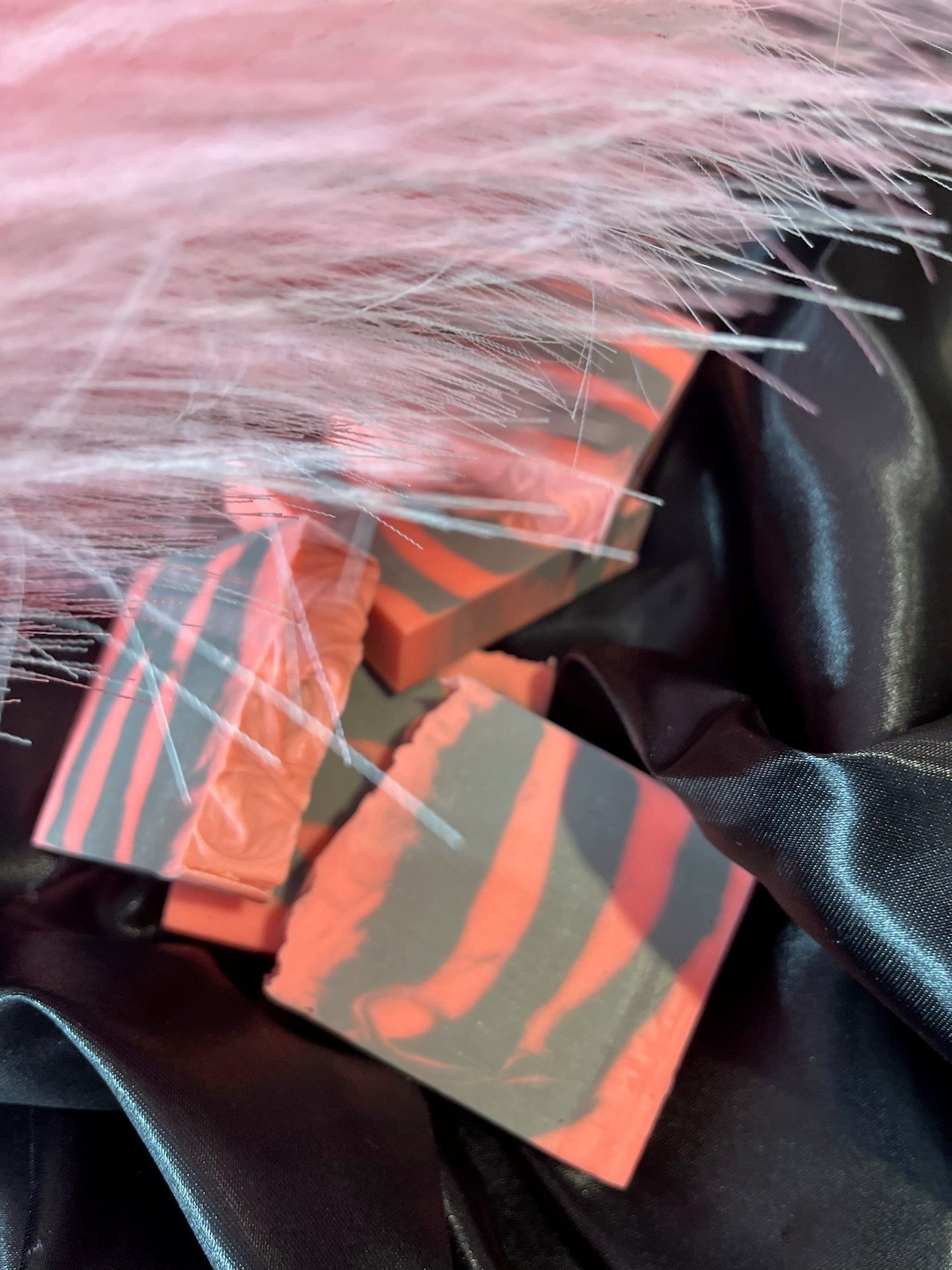 Coral and gray soap bar slices with bold stripe pattern